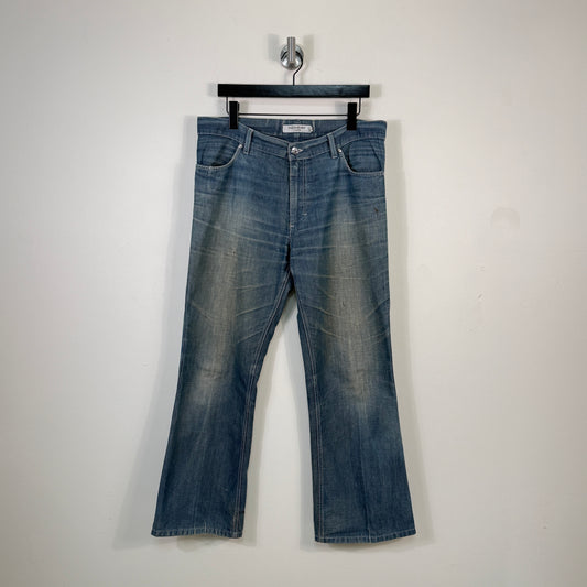 Yves Saint Laurent Distressed Logo Flared Denim